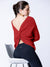 Open back knit sweater with a knot detail in red
